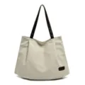 Minimalist large capacity beige canvas tote bag with contrasting black shoulder straps - White
