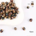 Cuentas espaciadoras de cerámica esmaltada marrón ovalada 9x7mm para joyería DIY 10pz - Baquetas