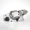 Detail of western vintage belt featuring black and white cow print and ornate silver buckle. - Black and White Cow Print