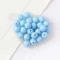 Close-up detail view of light blue acrylic round beads for creative DIY jewelry making projects. - Light Blue