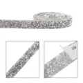 Close-up detail of silver resin rhinestone strip, sparkling diamond ribbon with adhesive. - 10mm / White