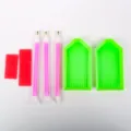 Complete DIY diamond painting tool kit with green trays, pink pens, and red wax pads. - Diamond Pen Set