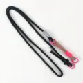 Close-up detail of the black crossbody phone lanyard featuring a vibrant pink green braided segment. - 06# Black
