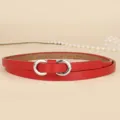 Close-up of metallic silver infinity buckle on a vibrant red thin leather dress belt - 110cm / Red