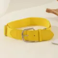 Close-up of bright yellow elastic baseball belt with silver buckle and PU leather details - 105cm / Yellow