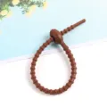 Attache cable silicone marron auto-bloquant organiseur de cordons pour chargeur et cles - 5 Pièces / Marron