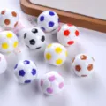 Detailed macro view of colorful 3D resin soccer ball figurines for DIY accessories - Multicolor