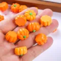 Close-up detail of cute miniature orange resin pumpkins for Halloween DIY crafts and decor - Orange Mini Pumpkin (MG-08091) / 1 Piece