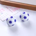 Detailed view of two small resin 3D soccer ball ornaments in blue and white color - Blue