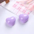 Macro view of two purple glossy heart-shaped resin accessories for DIY jewelry and crafts - Heart Shape (MG-2344) / 1 Piece / Light Purple