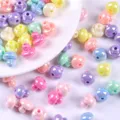 Macro view of colorful iridescent mushroom acrylic beads for DIY jewelry making - Mushroom