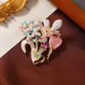Exquisite enamel fairy brooch with pearls and star crystal details in gold finish. - Pink