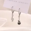 Stylish asymmetric silver-toned musical note and black guitar dangle earrings for women - Black Guitar Musical Note Earrings / Platinum/Black