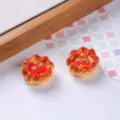 Detailed macro view of two realistic miniature resin egg tarts with strawberry toppings. - Strawberry Egg Tart