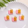 Detailed view of cute resin teddy bear charms for DIY jewelry and phone case decor - Bear with Stool Pendant