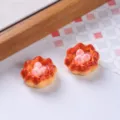 Detailed close-up of miniature resin egg tarts with pink heart center for DIY craft projects - Peach