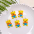 Close-up of five cute resin teddy bear charms for DIY phone cases and jewelry accessories - Orange Top Blue Pants Bear Pendant