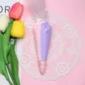 Macro view of dual-color pink and purple cream glue in a piping bag with nozzle. - 100g Bag (With 2 Nozzles) / Pink+Purple