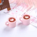 Detailed view of pink miniature resin coffee cup ornaments with tiny heart latte art - 粉杯加爱心 / 2 Pcs/Set / Pink
