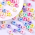 Macro view of vibrant AB plated colorful acrylic beads for unique DIY jewelry making - Circle