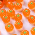 Detailed macro view of glossy orange resin mini pumpkins for Halloween DIY craft decor - Transparent Orange Mini Pumpkin (MG-08091) / 1 Piece
