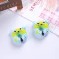 Macro detail of cute cartoon animal donut resin charms for DIY shoe and hair accessories - Blue Style