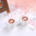Close-up of miniature resin coffee cups with heart-shaped latte art - 白杯加一箭穿心拉花 / 2 Pcs/Set / White
