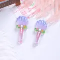 Detailed macro shot of glittery shell-topped magic wand resin charms for DIY jewelry - Purple Shell Magic Wand