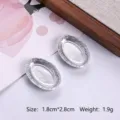Close-up of miniature silver oval plates showing size and weight for dollhouse DIY - Small Oval Style (MG-257)