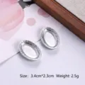 Detail view of miniature silver oval trays with floral patterns for dollhouse DIY crafts - Medium Oval Style (MG-257)