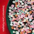 Macro view of colorful Christmas themed polymer clay slices for nail art and DIY crafts - Snowman Candy Cane Pumpkin / 50g Pack
