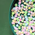 Close-up of colorful paw-shaped polymer clay slices for nail art decoration - Baby Feet / 50g Pack