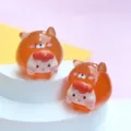 Close-up detail of cute translucent orange jelly cartoon animal DIY figurines for charms - M / Reddish Brown Dog