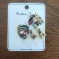Detailed macro shot of a vintage alloy bow brooch with colorful sparkling rhinestones - Bowknot Style (1)