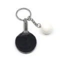 Detailopname van mini tafeltennisbatje sleutelhanger met getextureerd rubberen vlak - 6cm / Zwart