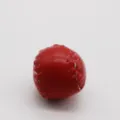 Detailed close-up view of a red leather mini baseball accessory with white stitching - 2cm / Red