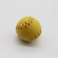 Macro view of a mini yellow softball keychain pendant with red stitching detail - 2cm / Dark Yellow