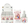 Ensemble d'huiles essentielles d'aromathérapie avec boîte de présentation et flacon. - Cerise et pêche blanche