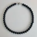 Polished black beaded necklace featuring a sleek silver magnetic ball clasp choker - 10mm Necklace / Black