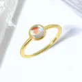 Detailed macro view of an elegant gold ring with round iridescent moonstone - Size 6 / 18K Gold