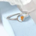 Macro detail of artificial moonstone ring with beautiful iridescent reflections - Size 6 / White Gold