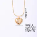 Close-up of gold heart initial E pendant necklace detail, sparkling zircon details, elegant design. - Letter E