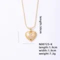 Gold heart initial K pendant necklace featuring snake chain and beaded border design. - Letter K