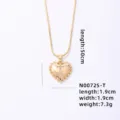 Gold heart letter T pendant necklace with beaded edge detail and chain, elegant fashion jewelry. - Letter T