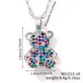 Detailed close-up of colorful cubic zirconia teddy bear pendant necklace with silver chain. - N01213-18