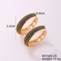 Vista detallada de pendientes de aro ovalados dorados con circonitas negras chic. - Dorado Con Zirconia Negra