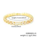 Gold tennis bracelet detail shot showing close-up of sparkling cubic zirconia stones and link. - Gold White Rhinestone