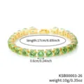 Detailed view of the green zirconia tennis bracelet showing sparkling round stones and gold. - Gold Olive Green Rhinestone