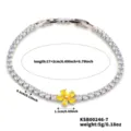 Elegant silver-tone chain bracelet with clear cubic zirconia and yellow flower accent - Yellow
