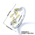 Detailed view of silver-plated leaf open ring with sparkling yellow and white cubic zirconia. - Silver Yellow Stone